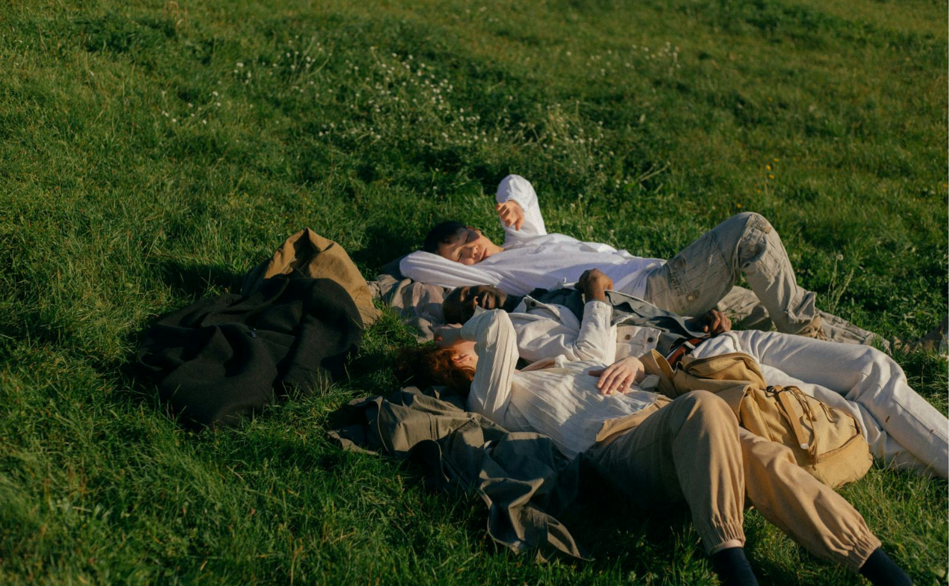 Teenagers lying in the grass